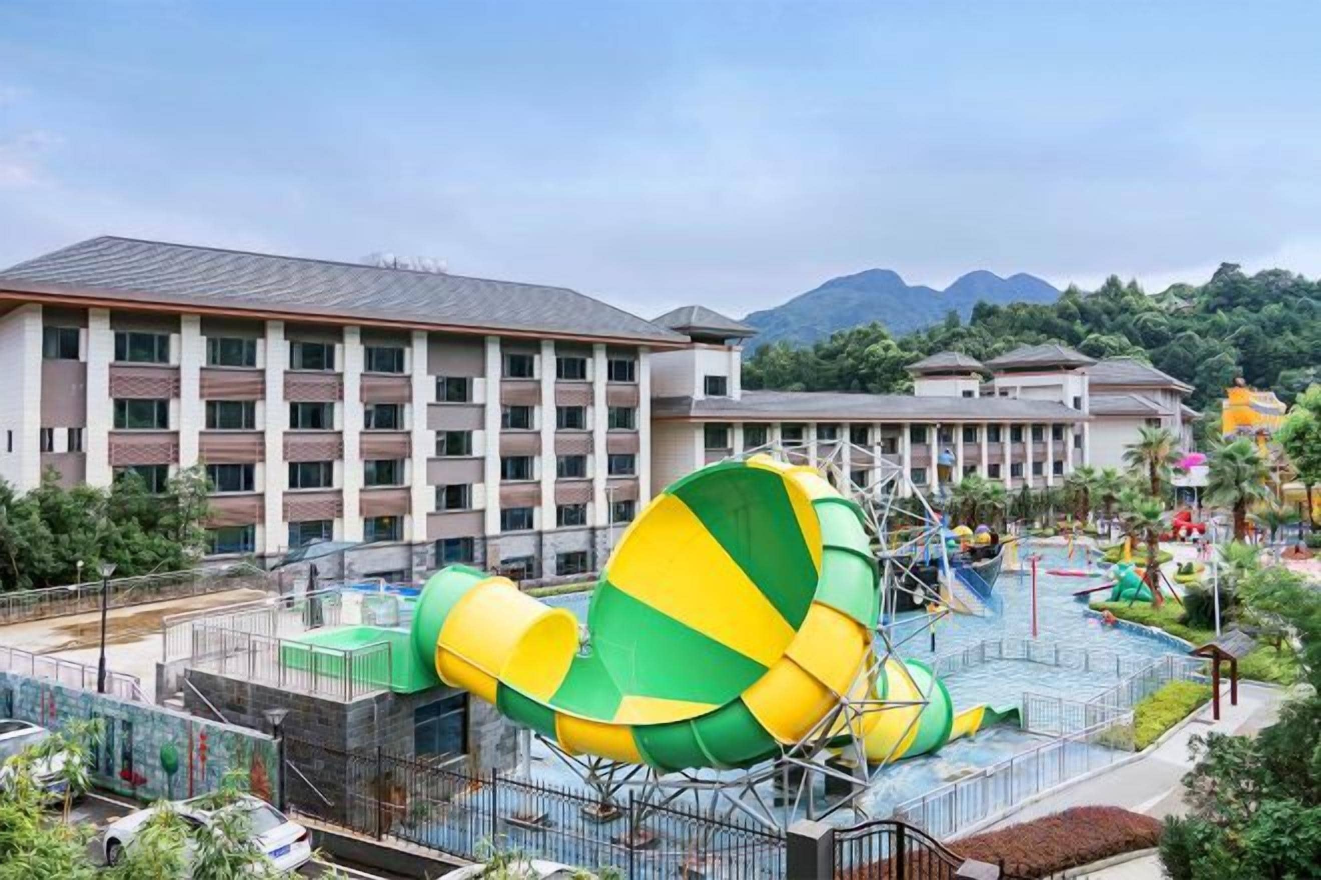 A hotel with a water park, including slides and a pool area.