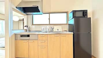 Fridge, microwave, electric kettle, cookware/dishes/utensils