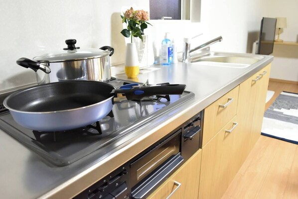 Fridge, microwave, cookware/dishes/utensils