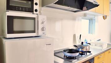 Fridge, microwave, cookware/dishes/utensils