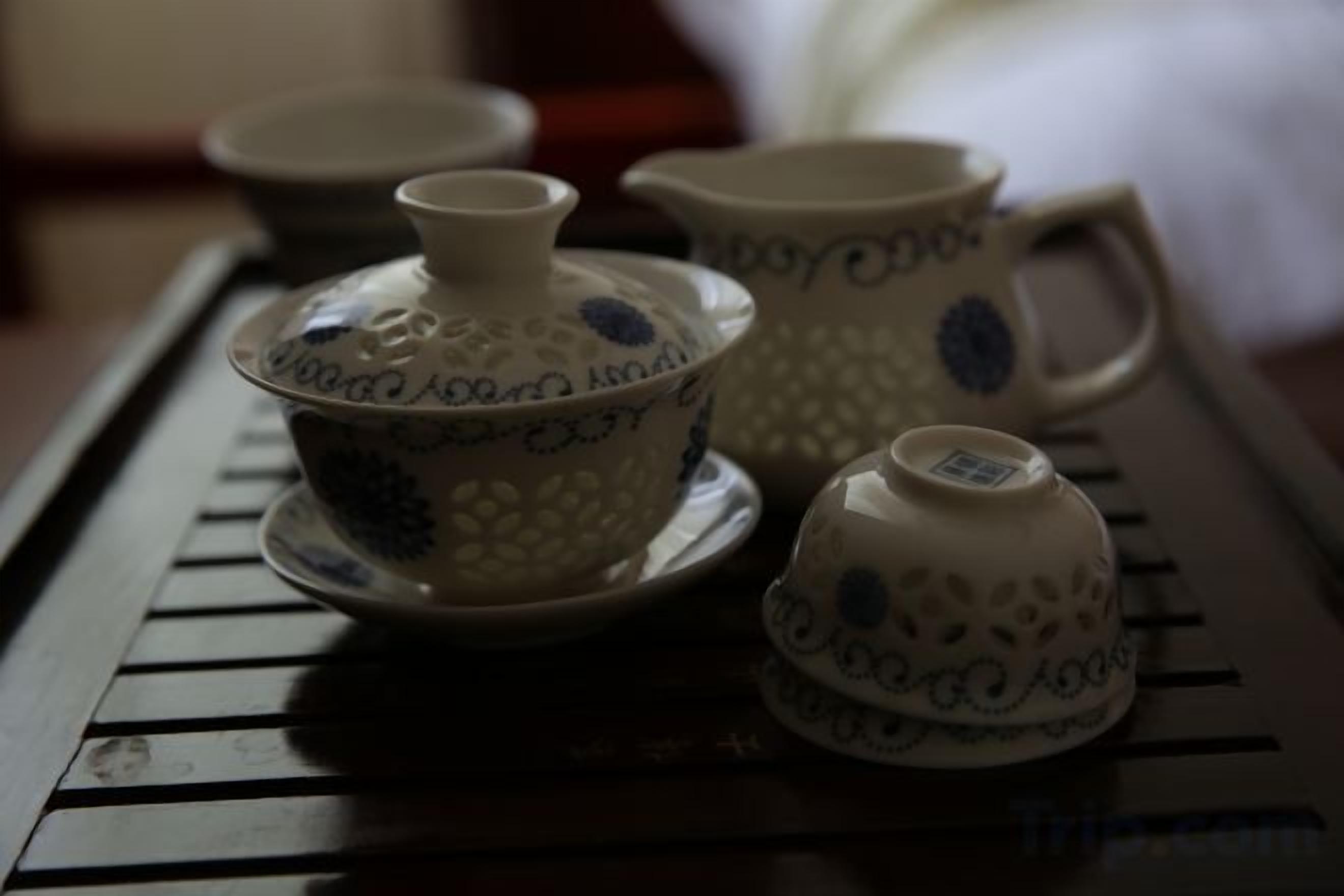 A tray with a teapot, a cup, and a saucer.