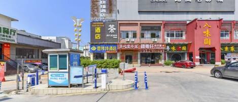 A commercial building with multiple storefronts, including a BINGO club and a cinema.