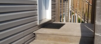 One bed apt w/ private bathroom (1) free charge (1) car parking.