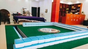 A room with a pool table, a bed, a desk, and a bookshelf. - Jianshi Hongshan Villa (Jianshi)
