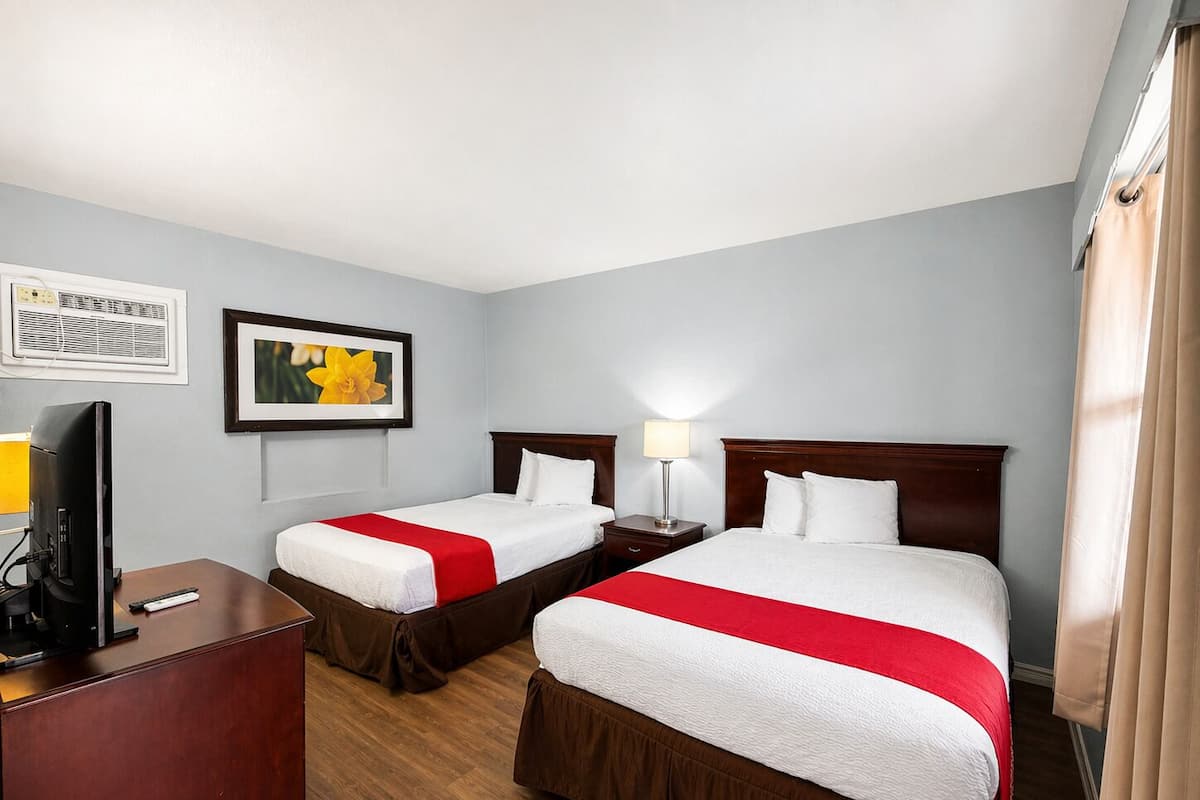 Room, 2 Queen Beds, Non Smoking | In-room safe, iron/ironing board, free WiFi, bed sheets