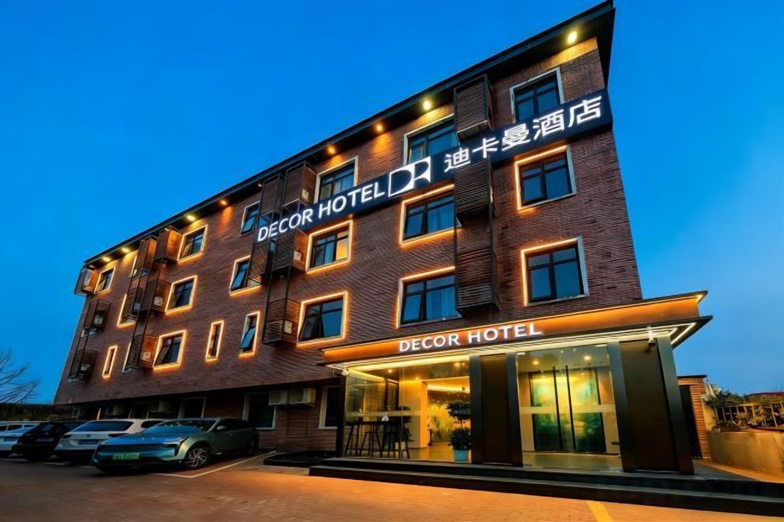 A multi-story hotel with a prominent entrance and signage.