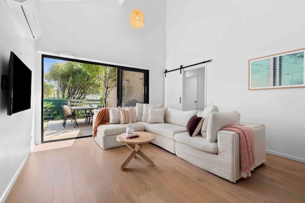 🛋️ Comfortable living area opening to outdoor patio