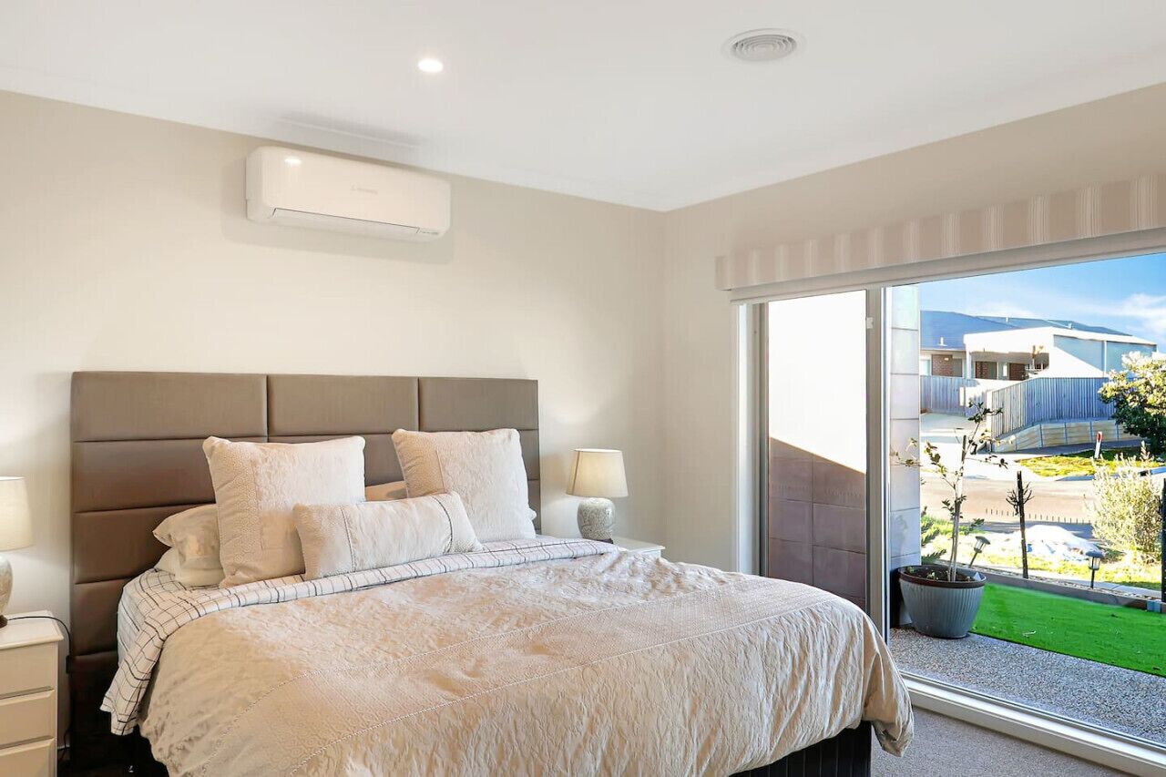 Downstairs master bedroom with a comfortable king bed and natural light