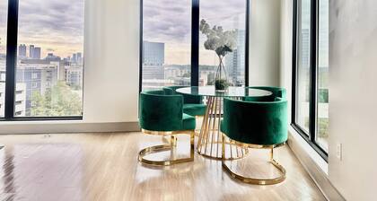 Ceiling to floor windows featuring a private balcony with stunning city views!