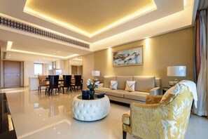 A modern hotel lobby with a central seating area, a dining space, and a sofa set. - Jti seaview resort (Lingshui)