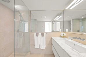 Shower, hair dryer, towels, toilet paper