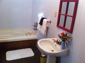 Jetted tub, towels, soap, toilet paper