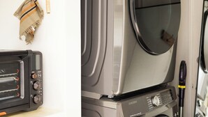 A stacked washer and dryer unit with a microwave and a small appliance on the counter.