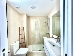Shower, hair dryer, towels, soap