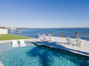 A heated pool - Ocean Sunrise – Bayfront Luxury with Pool, Dock & Game Room. Steps to Gulf. Perfect for Families. (Bradenton Beach)