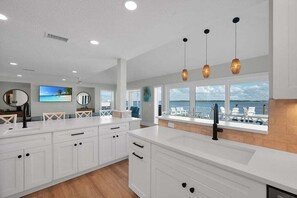 Fridge, microwave, oven, stovetop - Ocean Sunrise – Bayfront Luxury with Pool, Dock & Game Room. Steps to Gulf. Perfect for Families. (Bradenton Beach)