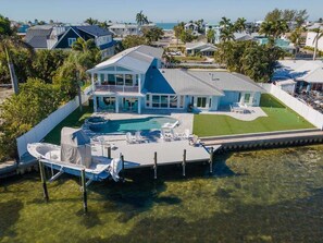 Exterior - Ocean Sunrise – Bayfront Luxury with Pool, Dock & Game Room. Steps to Gulf. Perfect for Families. (Bradenton Beach)