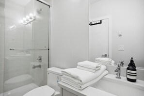 Shower, hair dryer, towels, soap
