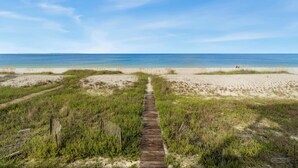 A beach path leading to the ocean with sand dunes and sparse vegetation. - Oak Rest Barn, is a custom built gulf front home w/pool, pet friendly, $250 credit for beach gear! (Port Saint Joe)