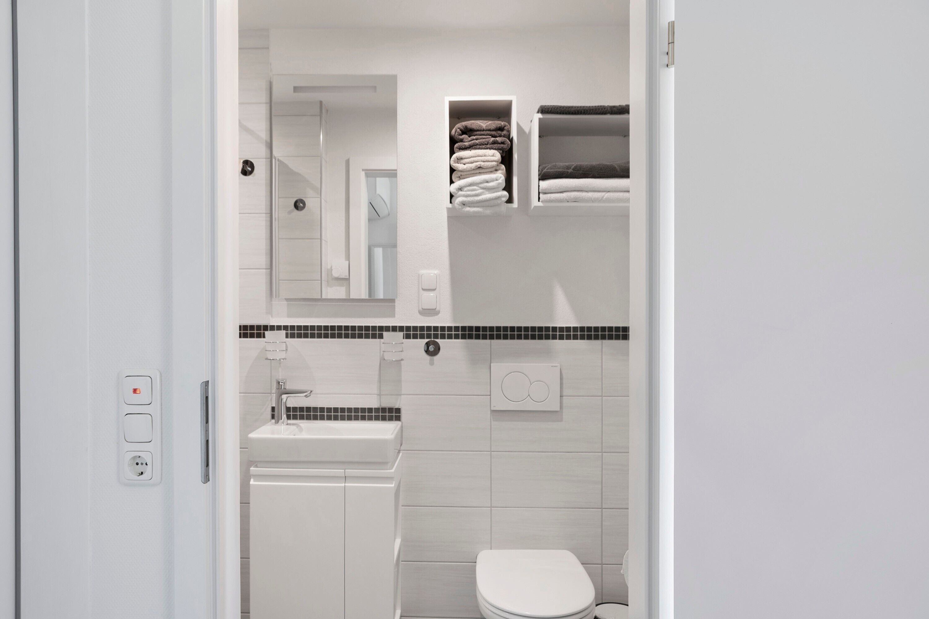 Ducha, secador de pelo y toallas