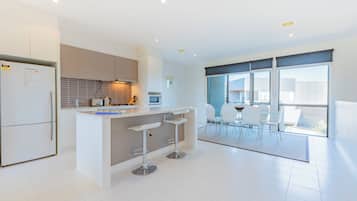 Standard Condo, Balcony, Garden View | Living area | 50-inch flat-screen TV with digital channels
