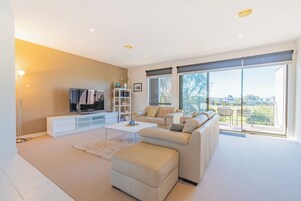 Standard Condo, Balcony, Garden View | Living area | 50-inch flat-screen TV with digital channels