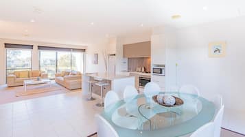 Standard Condo, Balcony, Garden View | Living area | 50-inch flat-screen TV with digital channels