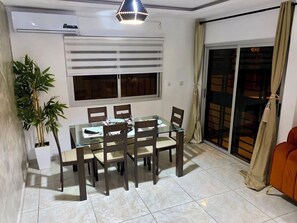 Enjoy meals in this dining area with a glass-top table and six comfortable chairs.