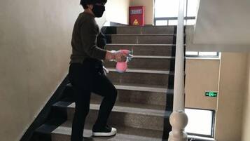 A person descending a staircase indoors.