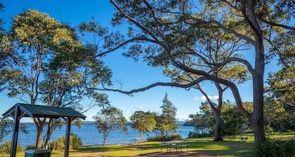 Brand new, modern two bedroom apartment. 5 minute walk to Paradise Beach!