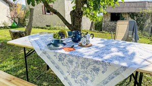 A table set outdoors with a tablecloth, bowls, a jug, and a teapot. - delle Maschere by Interhome (Valli del Natisone)