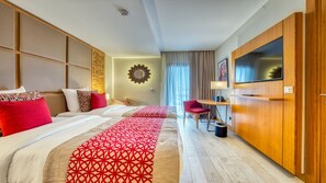 A hotel room with two beds, a TV, a desk, and a wardrobe. - Azalai Hôtel Dakar (Dakar)