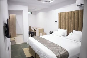 Deluxe Room, Balcony, City View | Desk, laptop workspace, free WiFi