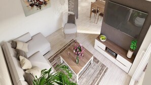 A modern living room with a sofa, coffee table, and a flat-screen TV. - Apartments Villa Subic - Two Bedroom Apartment with Balcony A2 (Kampor)