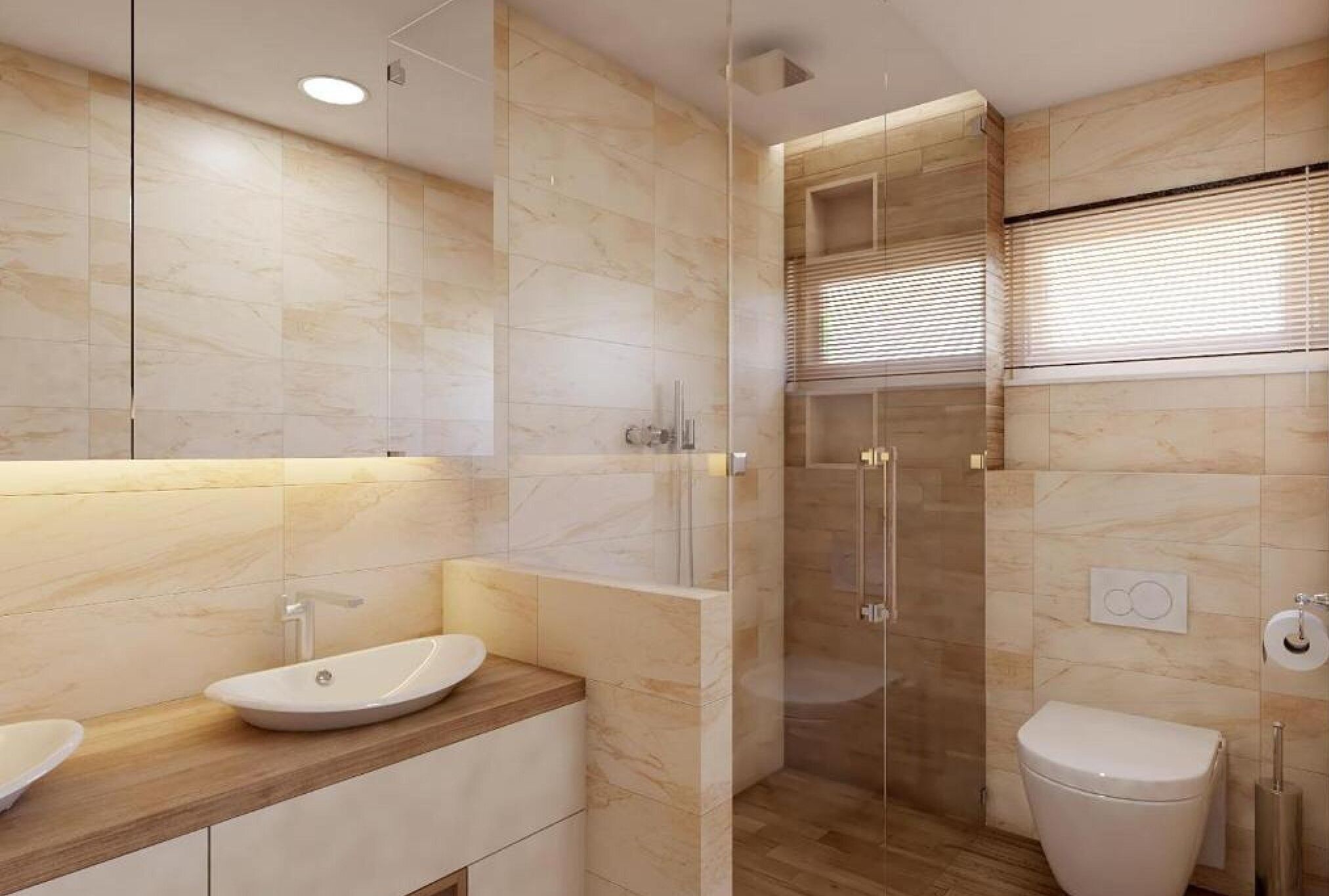 Un baño moderno con tocador de mármol, cabina de ducha de vidrio y un inodoro.