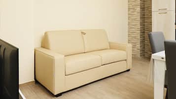 Superior Apartment | Living area | Flat-screen TV