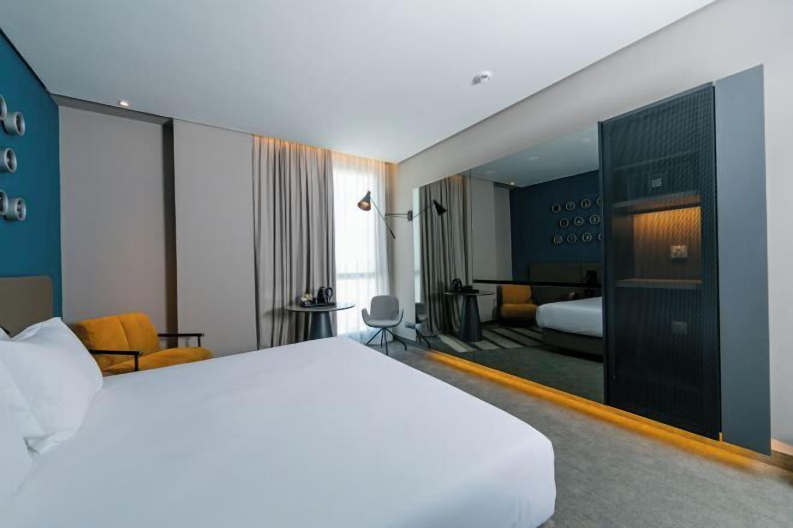 Premium bedding, in-room safe, laptop workspace, soundproofing