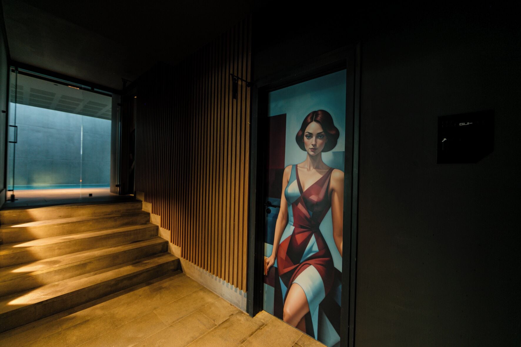 A staircase with wooden steps and a wall-mounted picture of a woman in a dress.