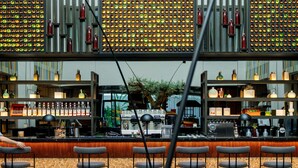 A modern bar area with seating and a view of the cityscape. - The NINE Lifestyle Experience (La Marsa)