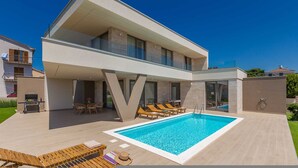A modern two-story house with a swimming pool, outdoor seating, and a barbecue area. - Villa Vista With Private Pool and Sauna (Krk)