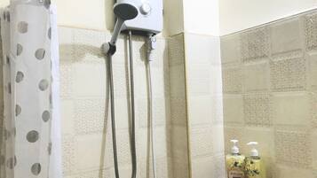 Shower, hair dryer, towels, soap