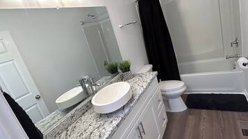 Hair dryer, towels, soap, shampoo