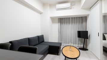 Superior Double Room | Living area | 32-inch flat-screen TV with cable channels