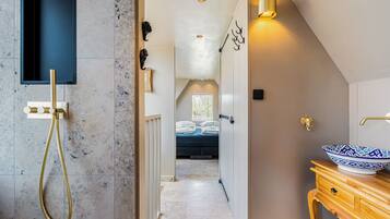 Shower, hair dryer, towels, soap
