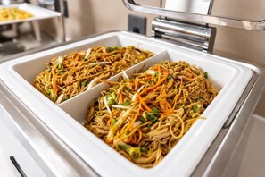 A buffet with two large white serving dishes filled with stir-fried noodles and vegetables. - Heyi Express Hotel (Zhuhai Baijiao Science Park Doumen Bus Terminal) (Zhuhai)