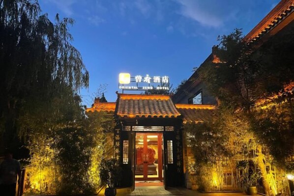 A traditional building with a sign for the Oriental Zen Hotel. - Oriental Zeng Hotel (Beijing)
