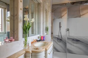 Luxury Condo | Bathroom | Shower, free toiletries, hair dryer, slippers