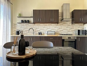 Fridge, microwave, oven, stovetop - This apartment is a 2 bedroom(s), 1.5 bathrooms, located in Il-Mellieħa, null. (Il-Mellieha)