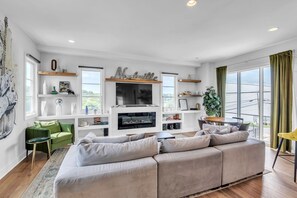 Townhome, Multiple Beds, Fireplace, City View (The Luxurious Champagne Cowboy) | Living area | 42-inch flat-screen TV with digital channels, fireplace - Chic Townhome for 10 W/rooftop (Nashville)