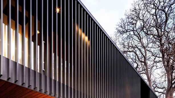 A modern building with a sloped roof and a flat facade. - The Conservatory Summ (Hobart)